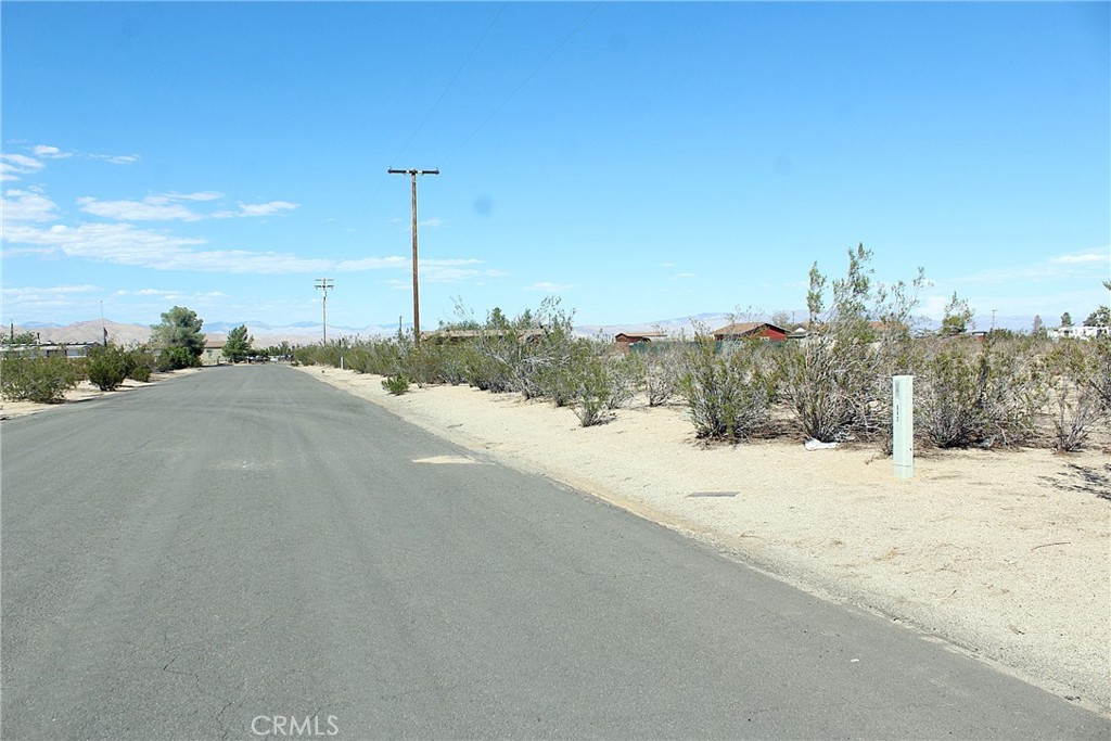 11 Olanche Street Mojave, CA 93501 - Photo 4 of 8 a view of a road with a building in the background