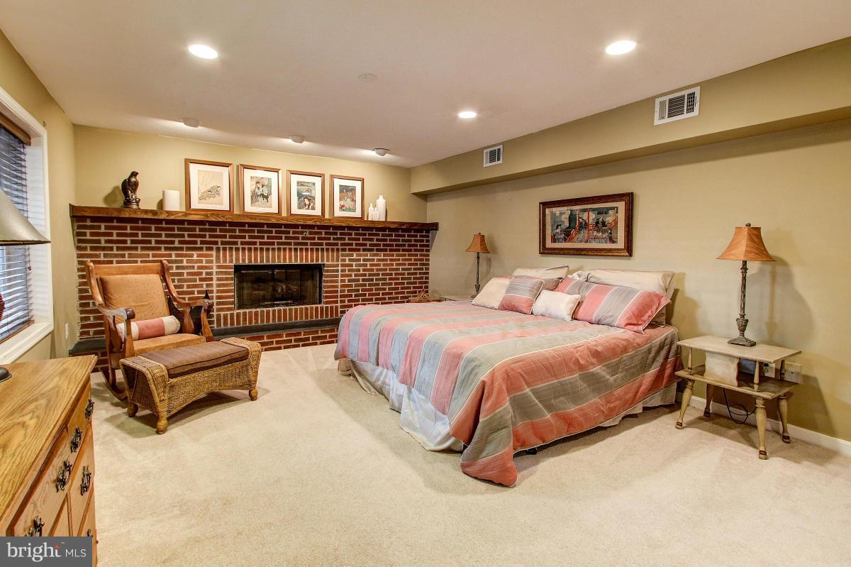 1418 Atwood Road Silver Spring, MD 20906 - Photo 23 of 29 Lower Level Bedroom #5 w/Fireplace