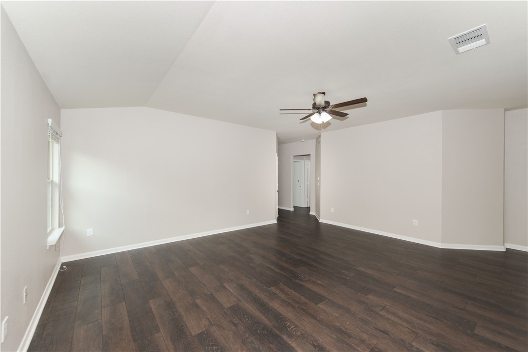 1007 Plateau Trail Georgetown, TX 78626 - Photo 5 of 32 a view of a room with wooden floor