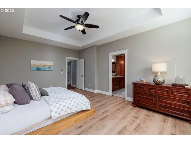 a bedroom with a bed and a dresser