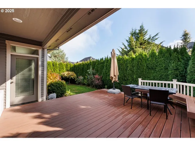 a view of a house with a flower garden