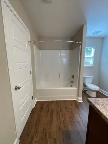 a bathroom with a toilet