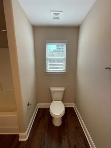 a view of kitchen island with wooden floor and outdoor view