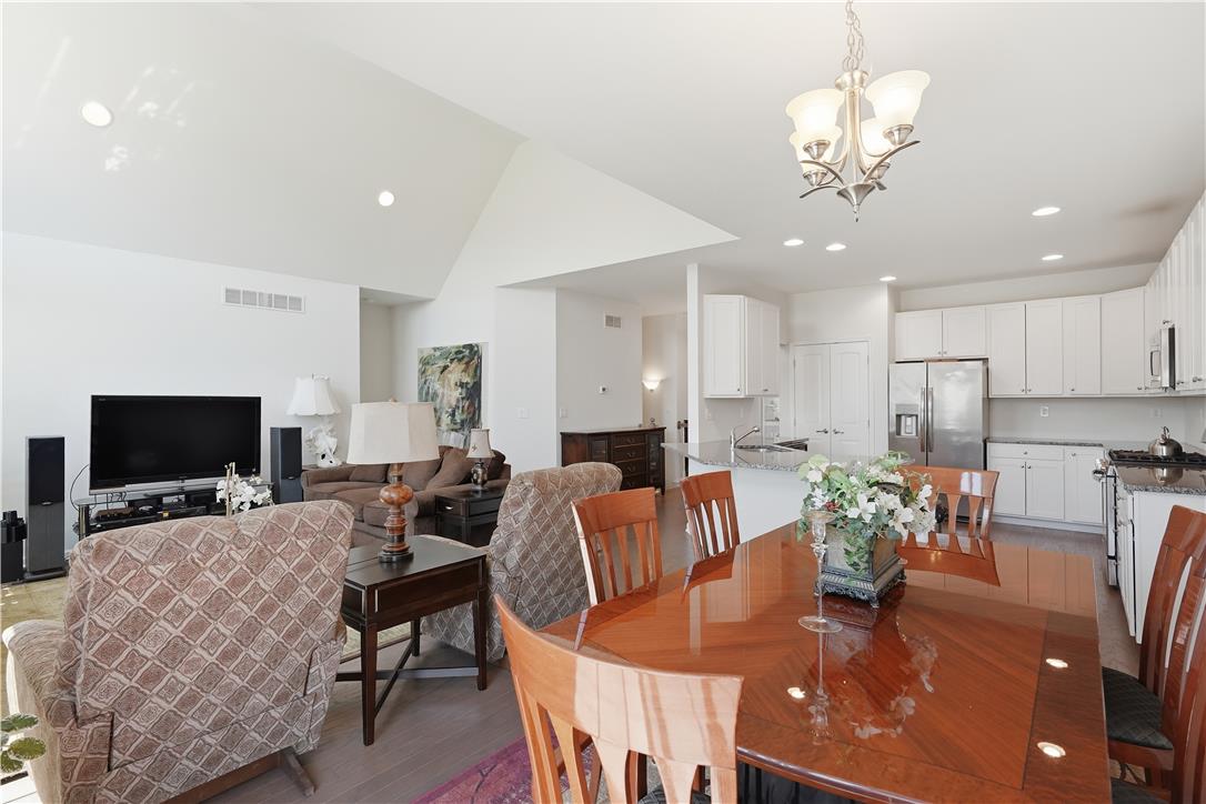 4120 Eveningstar Road Emmaus, PA 18049 - Photo 20 of 62 An open-concept living space with a dining area transitions seamlessly to the gourmet kitchen.