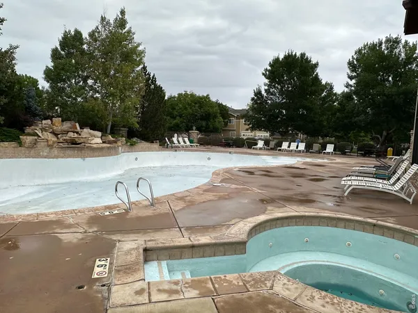 a view of a swimming pool with a patio
