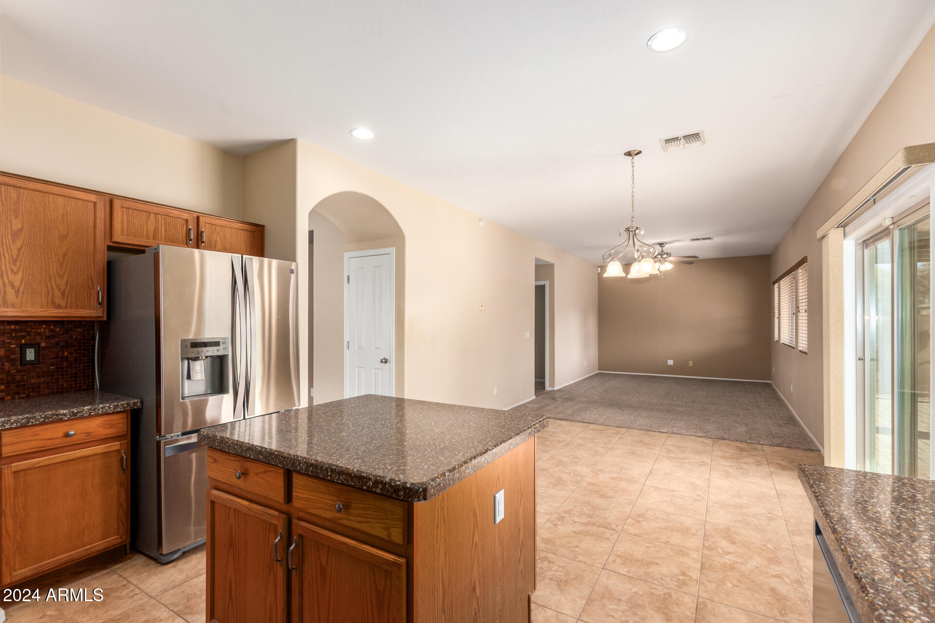 45335 West Rhea Road Maricopa, AZ 85139 - Photo 19 of 52 a view of a kitchen with a sink and refrigerator