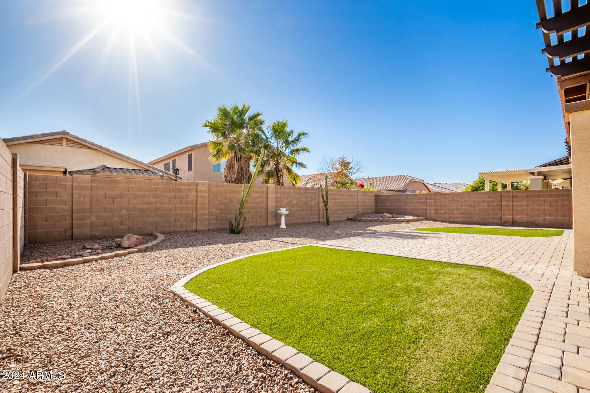 45335 West Rhea Road Maricopa, AZ 85139 - Photo 50 of 52 a view of a swimming pool with a lounge chair