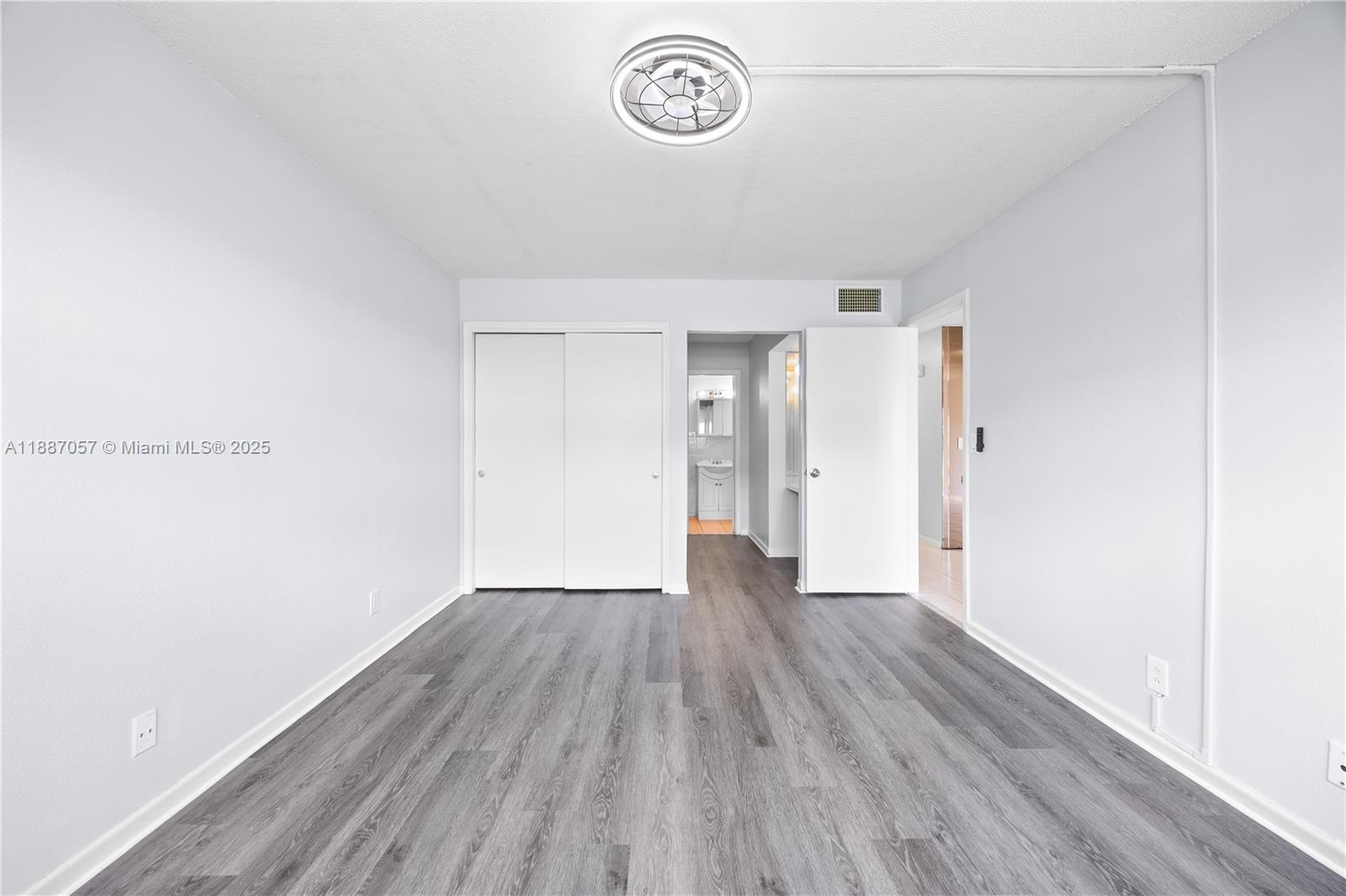 4200 Northwest 3rd Court, Unit 116 Plantation, FL 33317 - Photo 13 of 18 a view of a room with wooden floor and window