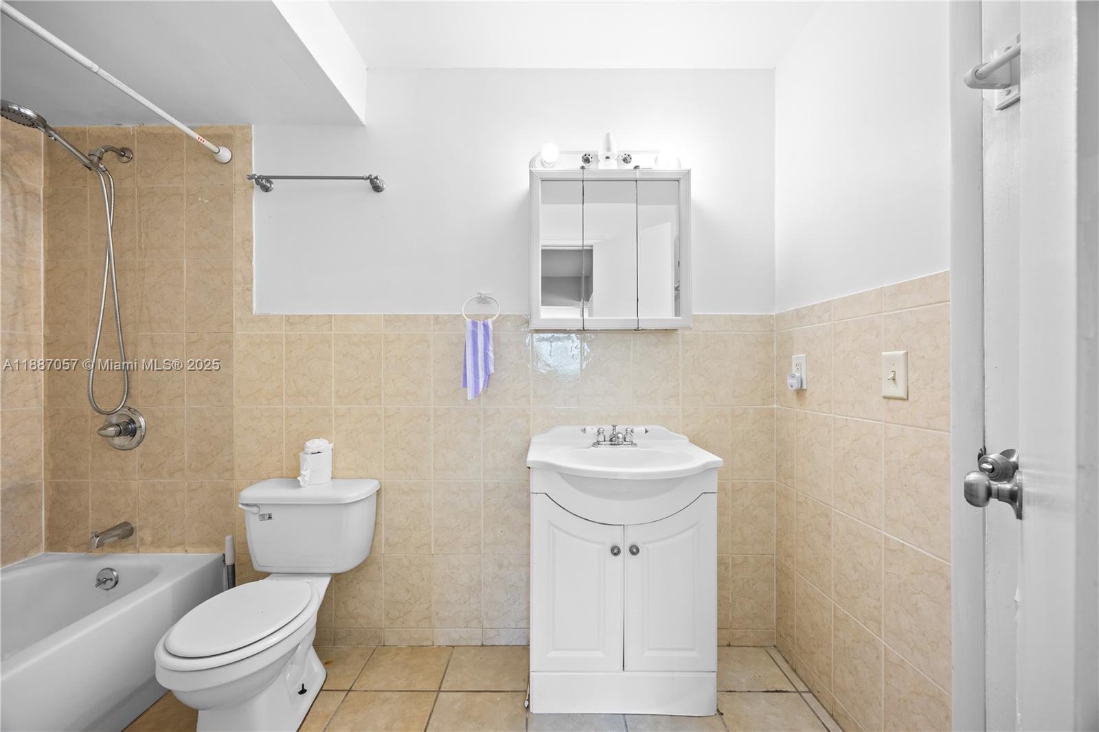 4200 Northwest 3rd Court, Unit 116 Plantation, FL 33317 - Photo 16 of 18 a bathroom with a sink a toilet and shower