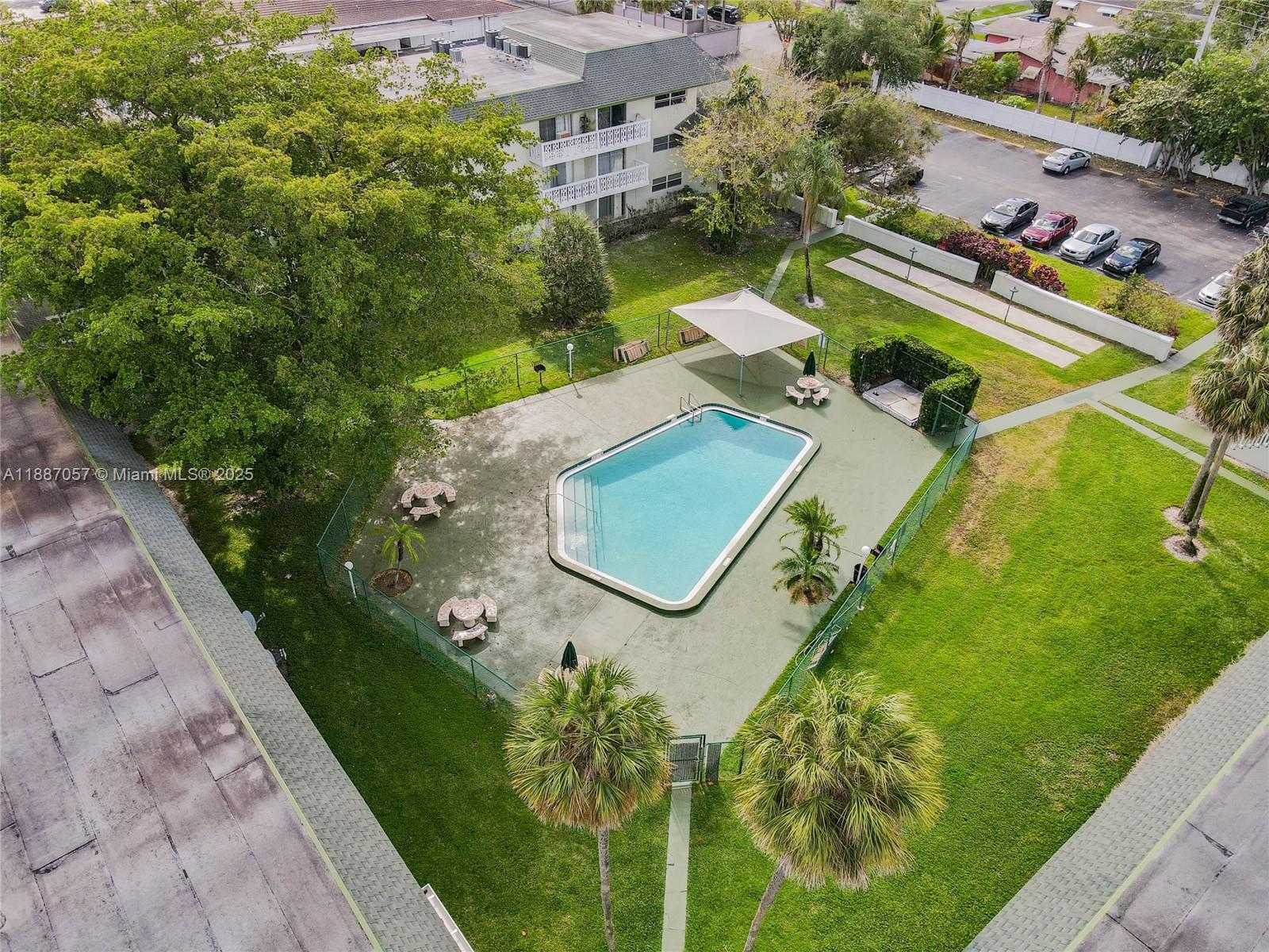 4200 Northwest 3rd Court, Unit 116 Plantation, FL 33317 - Photo 18 of 18 an aerial view of a house with a garden and swimming pool
