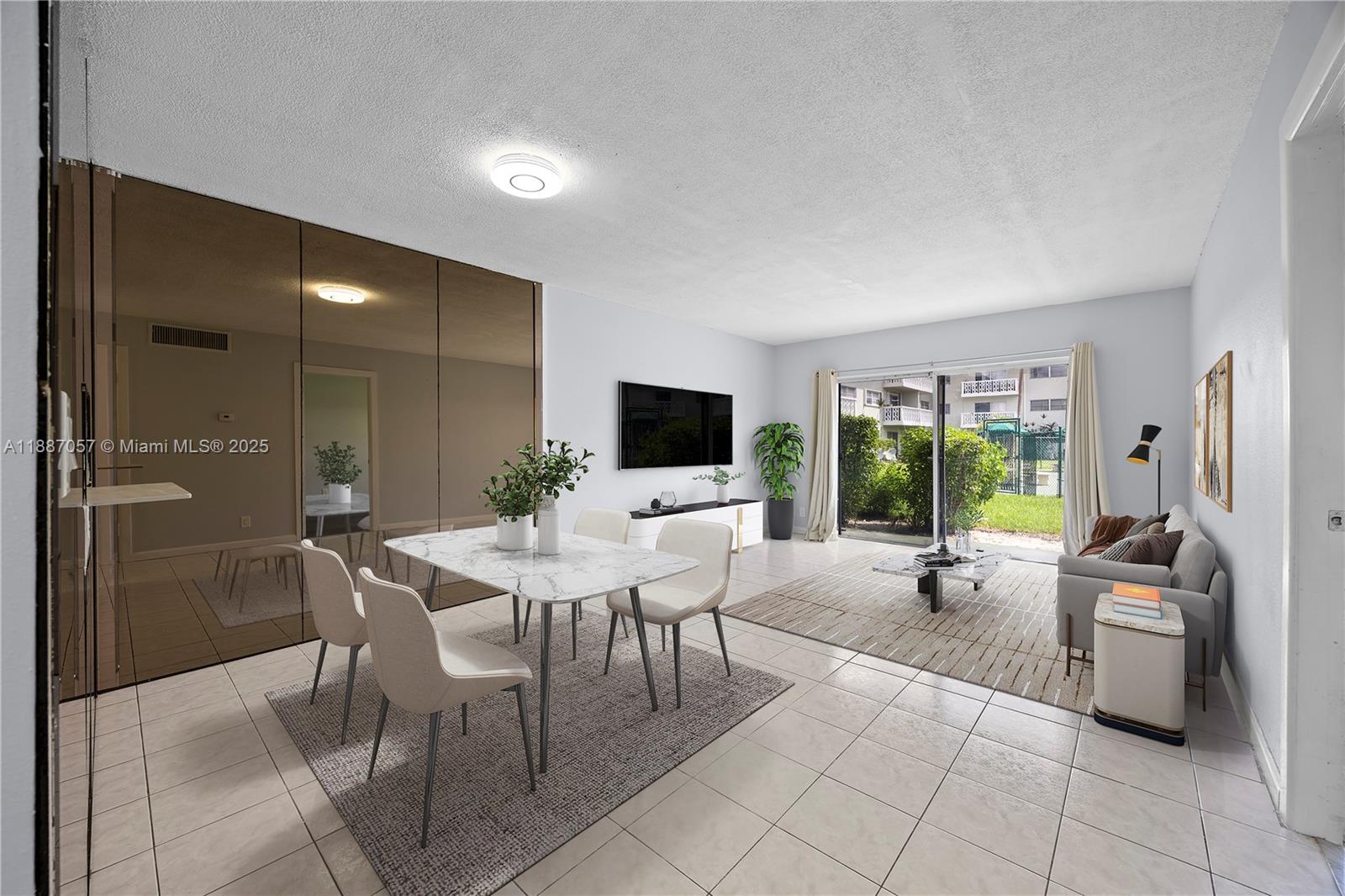 4200 Northwest 3rd Court, Unit 116 Plantation, FL 33317 - Photo 3 of 18 a view of a livingroom with furniture window and outside view