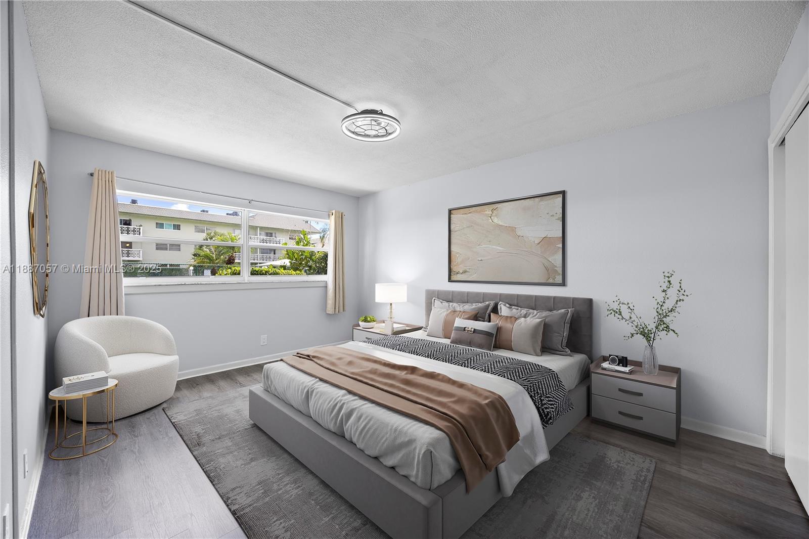 4200 Northwest 3rd Court, Unit 116 Plantation, FL 33317 - Photo 10 of 18 a bedroom with a bed and a window