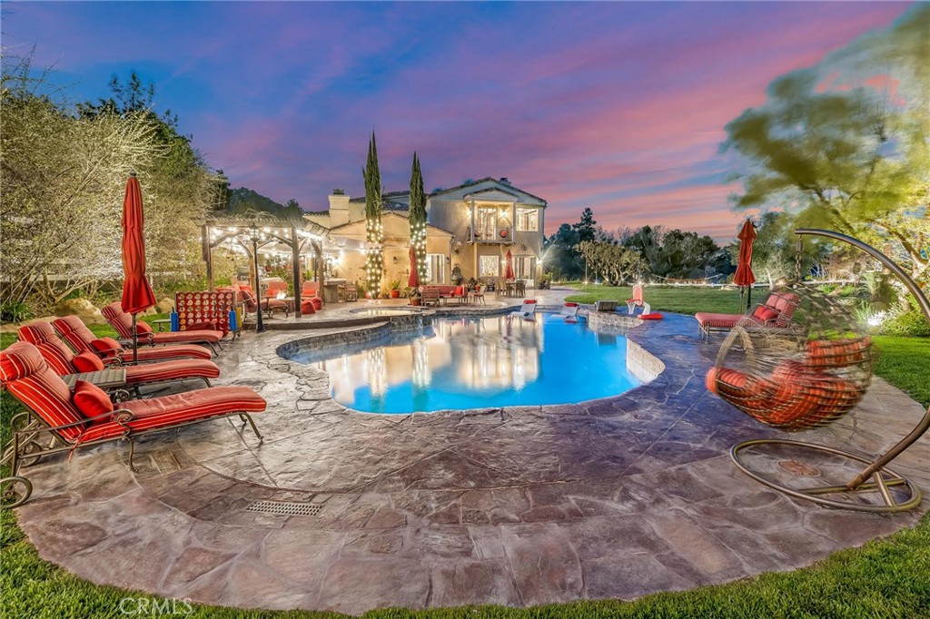 10 Sage Lane Bell Canyon, CA 91307 - Photo 1 of 65 a view of a swimming pool with a lounge chair