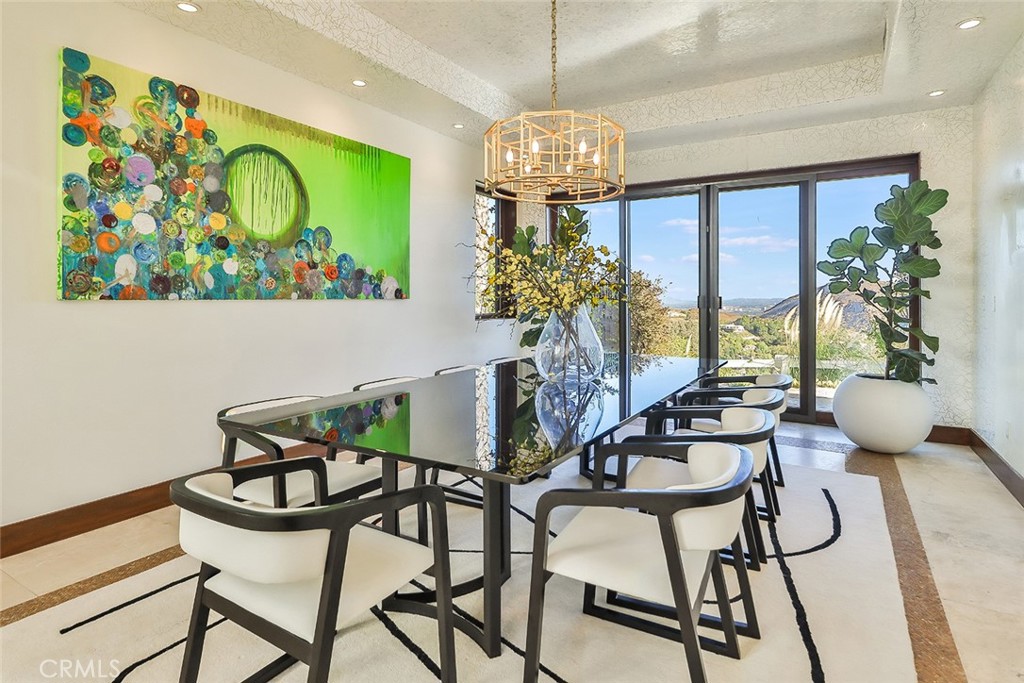 10 Sage Lane Bell Canyon, CA 91307 - Photo 13 of 65 a view of a dining room with furniture a livingroom and chandelier