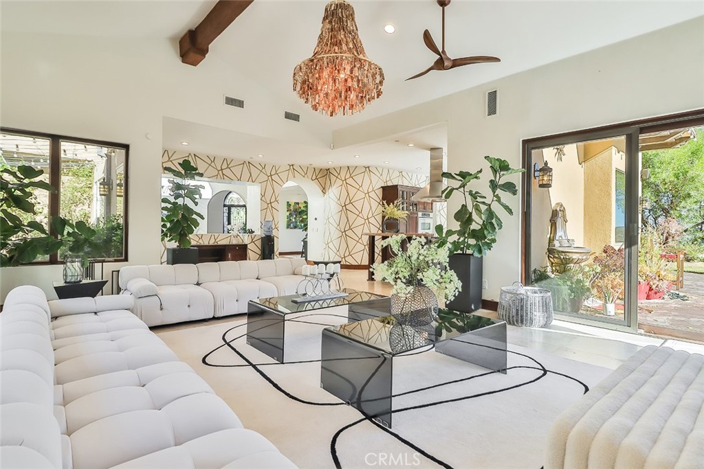 10 Sage Lane Bell Canyon, CA 91307 - Photo 2 of 65 a living room with furniture windows and a chandelier