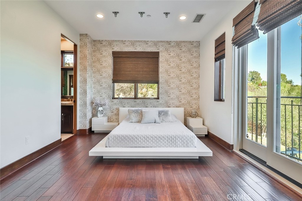 10 Sage Lane Bell Canyon, CA 91307 - Photo 29 of 65 a bedroom with a bed and a large window