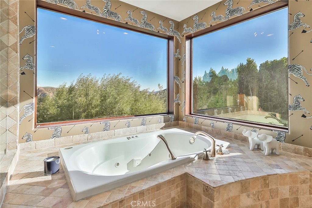 10 Sage Lane Bell Canyon, CA 91307 - Photo 36 of 65 a bath tub sitting in a bathroom next to a window