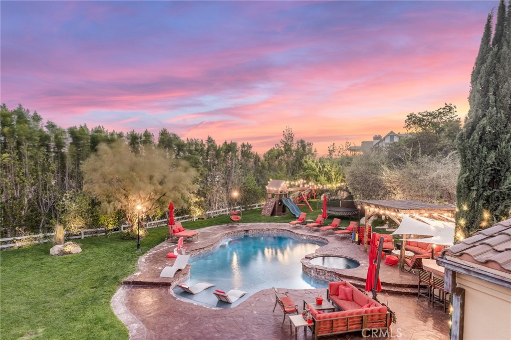10 Sage Lane Bell Canyon, CA 91307 - Photo 40 of 65 a view of a childrens park with swings and slides