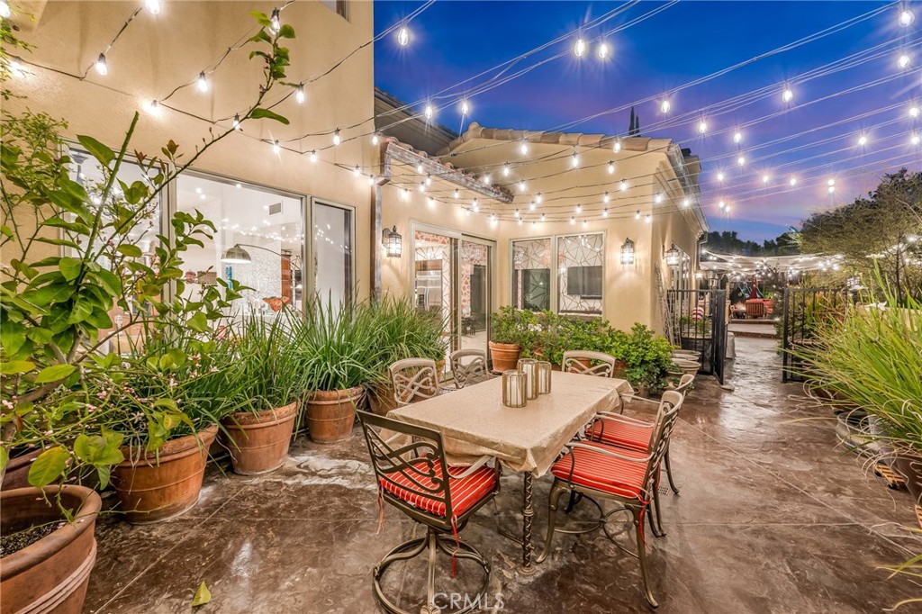 10 Sage Lane Bell Canyon, CA 91307 - Photo 57 of 65 a view of a patio with table and chairs and potted plants