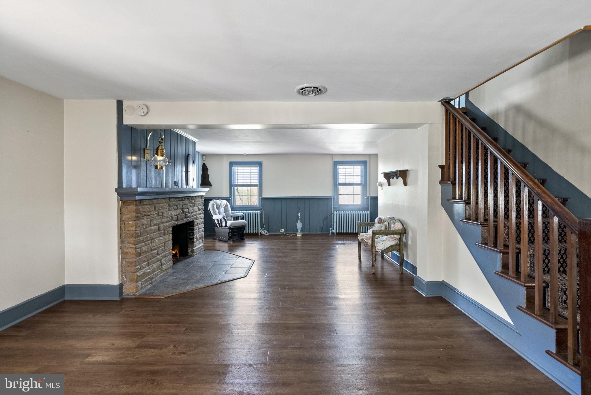 111 Mine Run Road Schwenksville, PA 19473 - Photo 39 of 60 a living room with fireplace furniture and a wooden floor