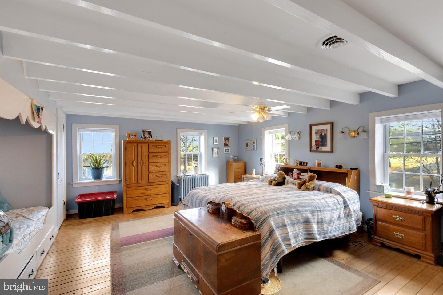 111 Mine Run Road Schwenksville, PA 19473 - Photo 46 of 60 a bedroom with a bed couch and windows