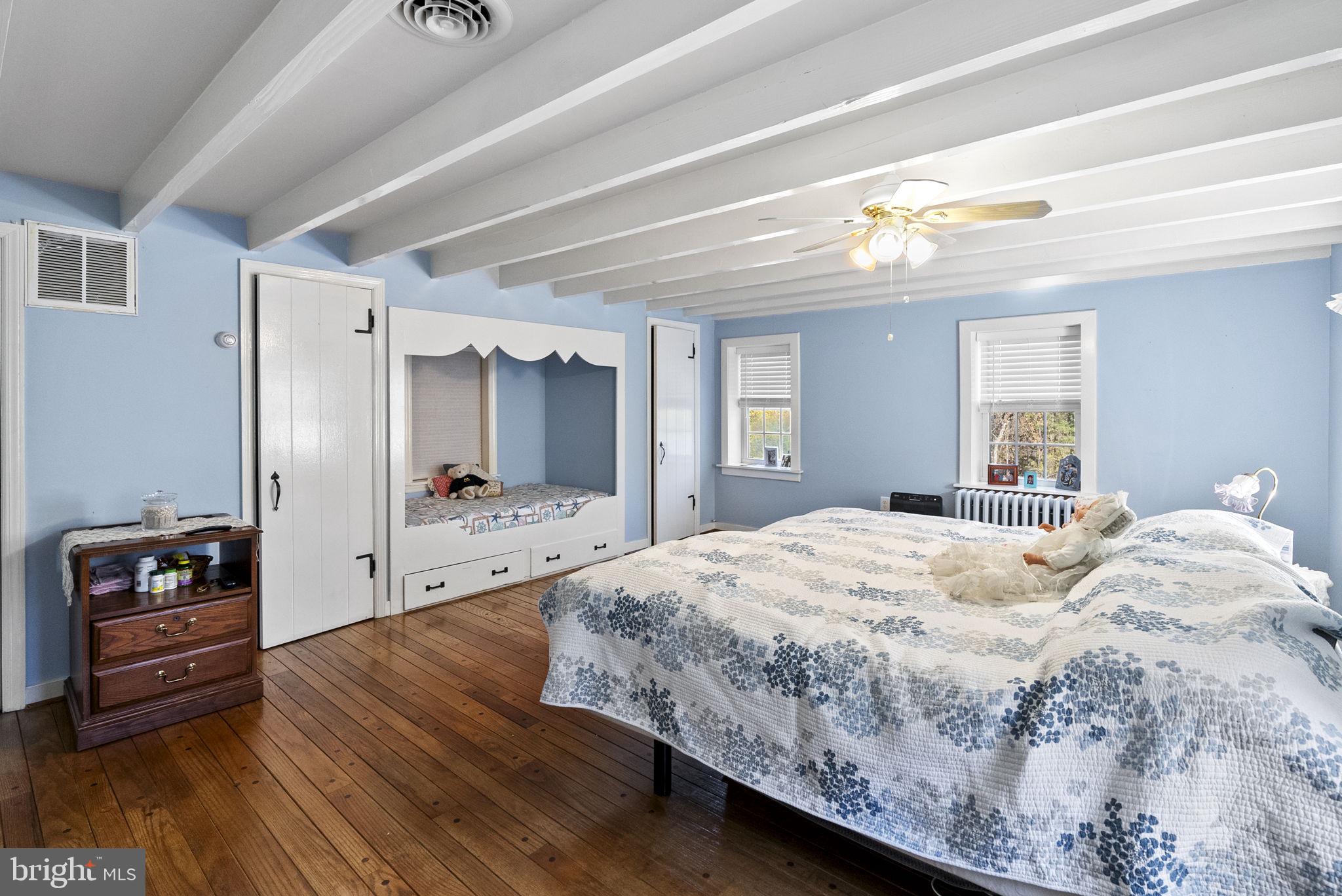 111 Mine Run Road Schwenksville, PA 19473 - Photo 49 of 60 a bedroom with a bed and a large mirror on the dresser