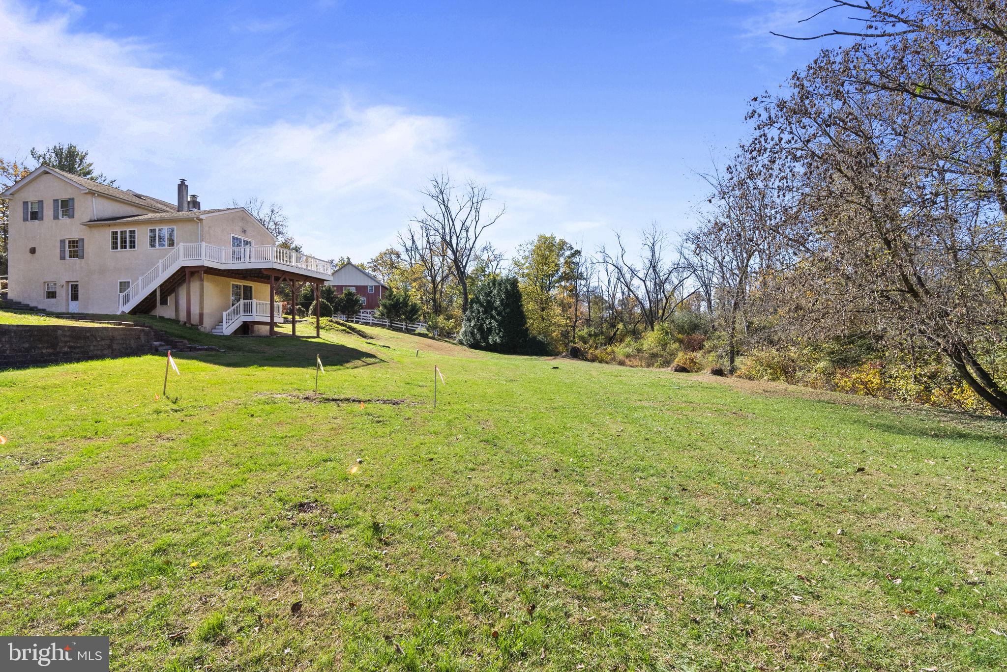 111 Mine Run Road Schwenksville, PA 19473 - Photo 5 of 60 a blue swimming pool is in the middle of a garden