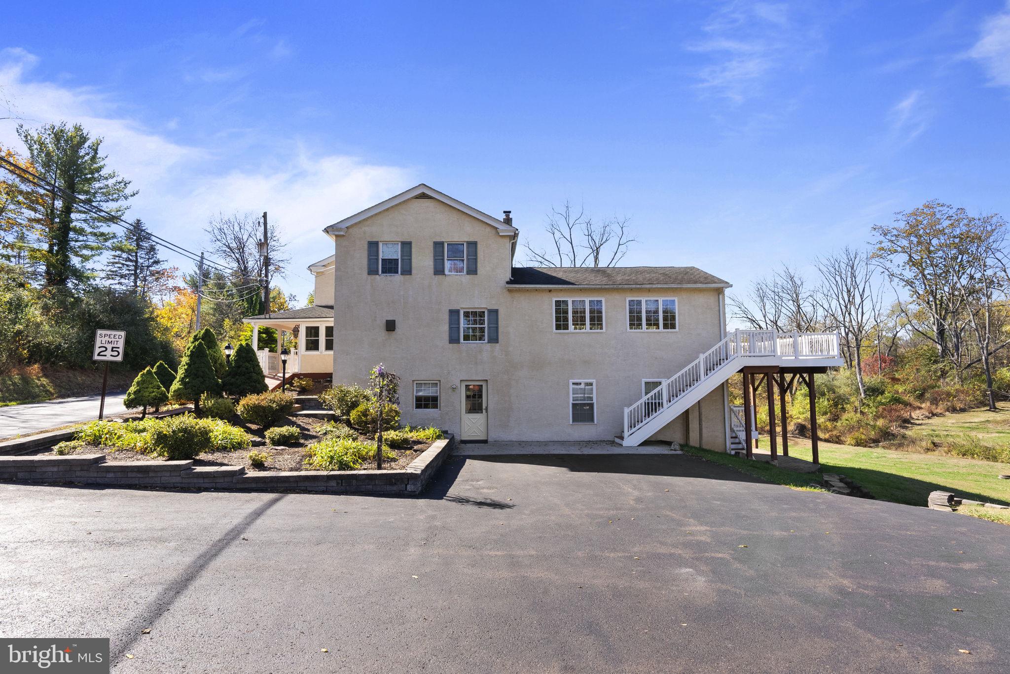 111 Mine Run Road Schwenksville, PA 19473 - Photo 6 of 60 a front view of a house with a yard and garage