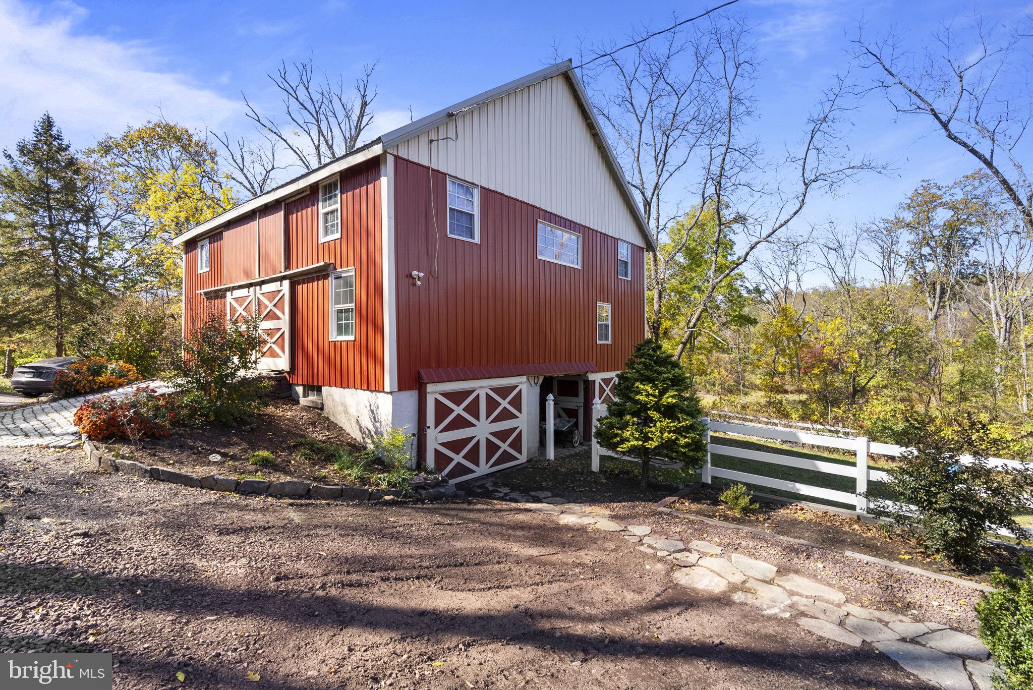 111 Mine Run Road Schwenksville, PA 19473 - Photo 8 of 60 a front view of a house with a garden