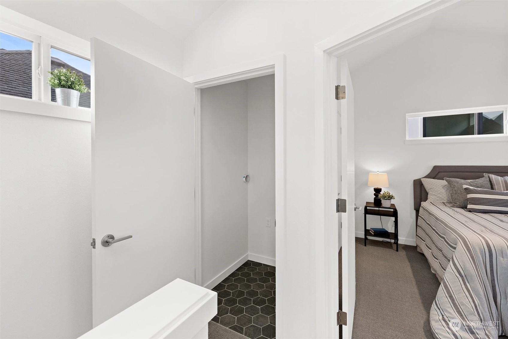 2119 South Walker Street, Unit B Seattle, WA 98144 - Photo 17 of 23 a bedroom with a bed and a window