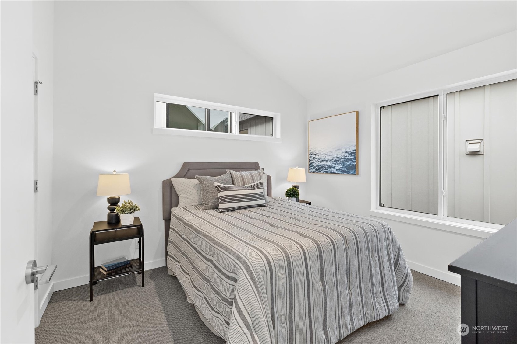 2119 South Walker Street, Unit B Seattle, WA 98144 - Photo 18 of 23 a bedroom with a bed and a lamp