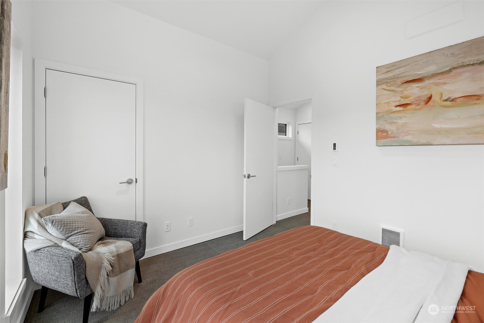 2119 South Walker Street, Unit B Seattle, WA 98144 - Photo 23 of 23 a bedroom with a bed and chair