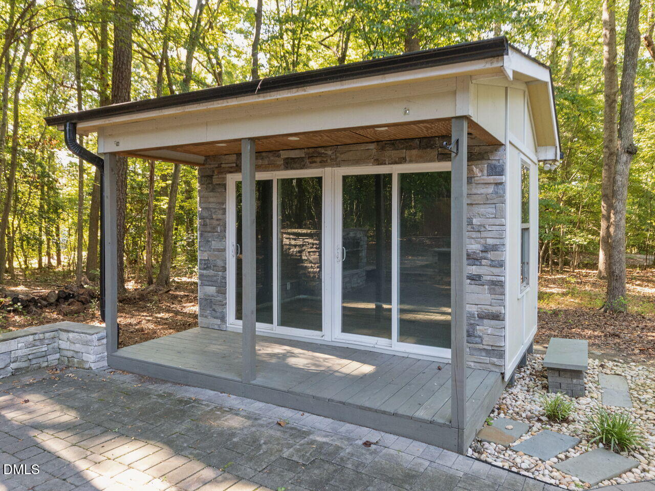 4100 Timberbrook Drive Raleigh, NC 27616 - Photo 29 of 36 Fantastic he/she shed with covered porch and sliding glass doors, perfect for a home office, studio, hobby space or private retreat.