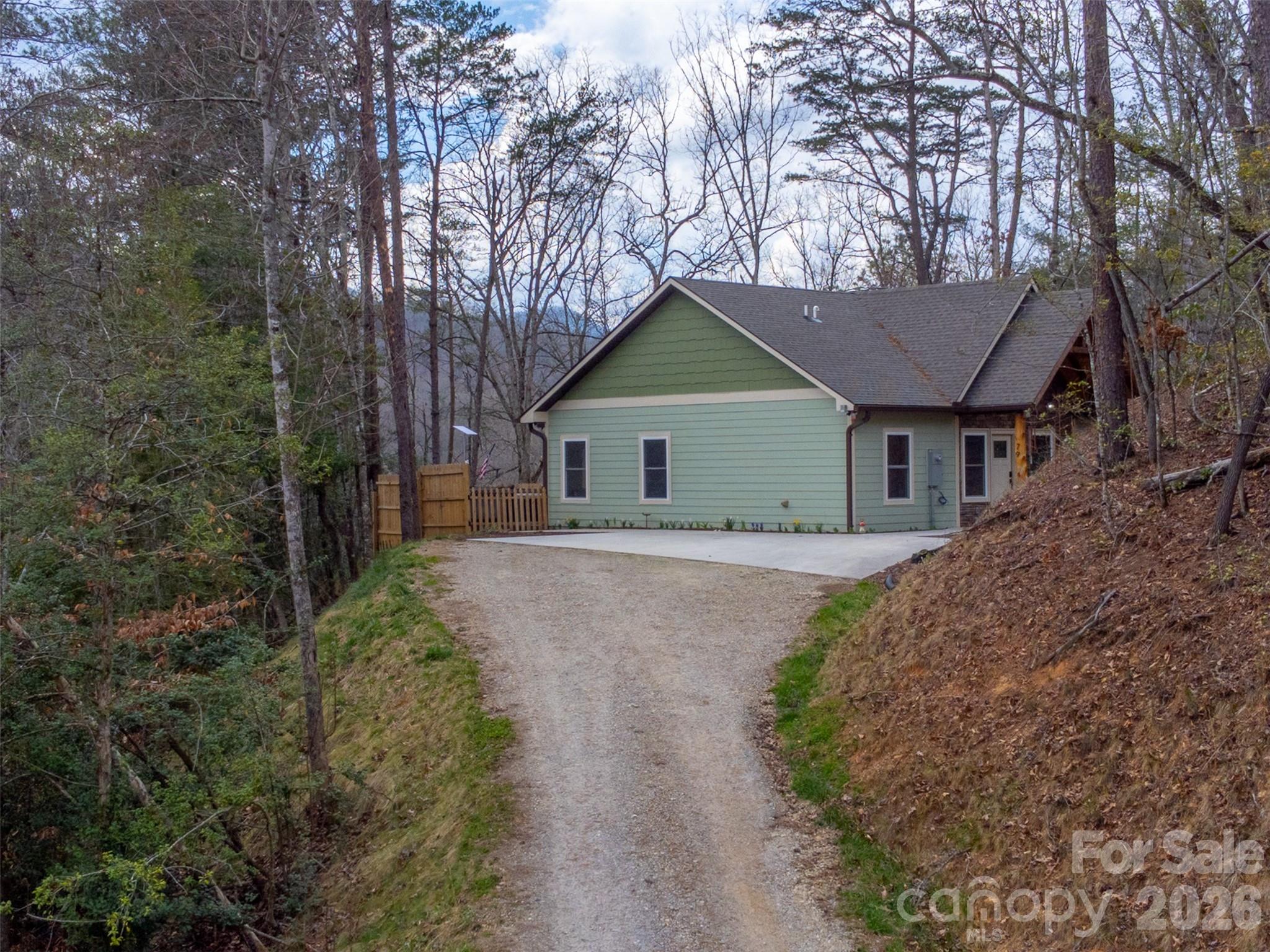 79 Abbey View Road Bryson City, NC 28713 - Photo 2 of 48 a house with trees in the background