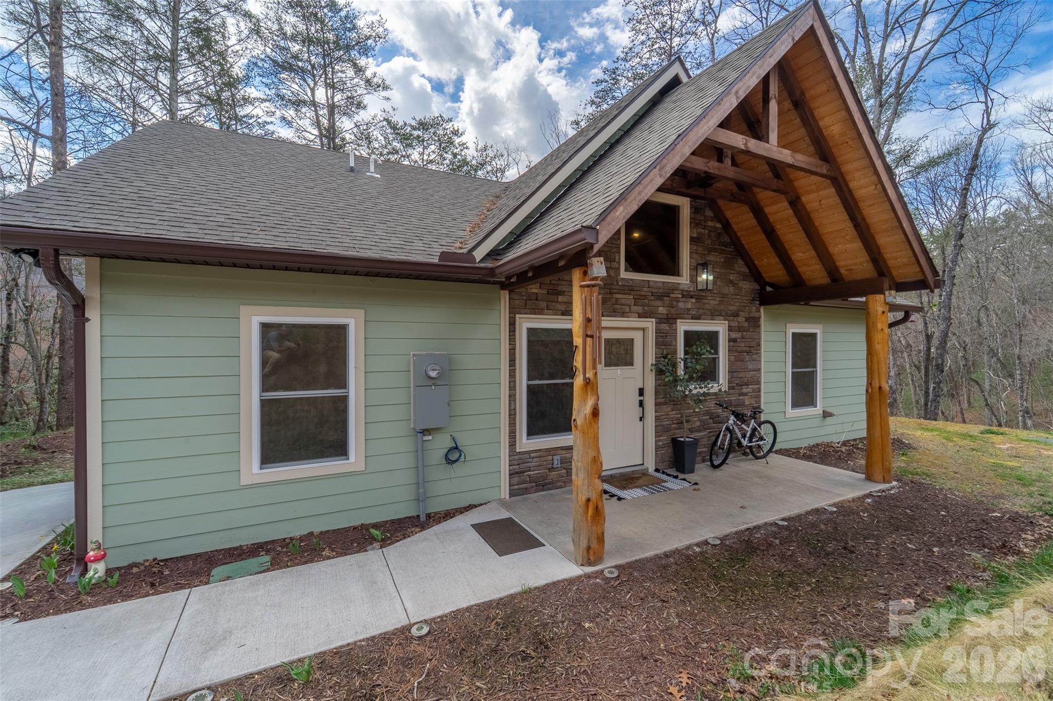 79 Abbey View Road Bryson City, NC 28713 - Photo 41 of 48 a front view of a house with yard and seating space