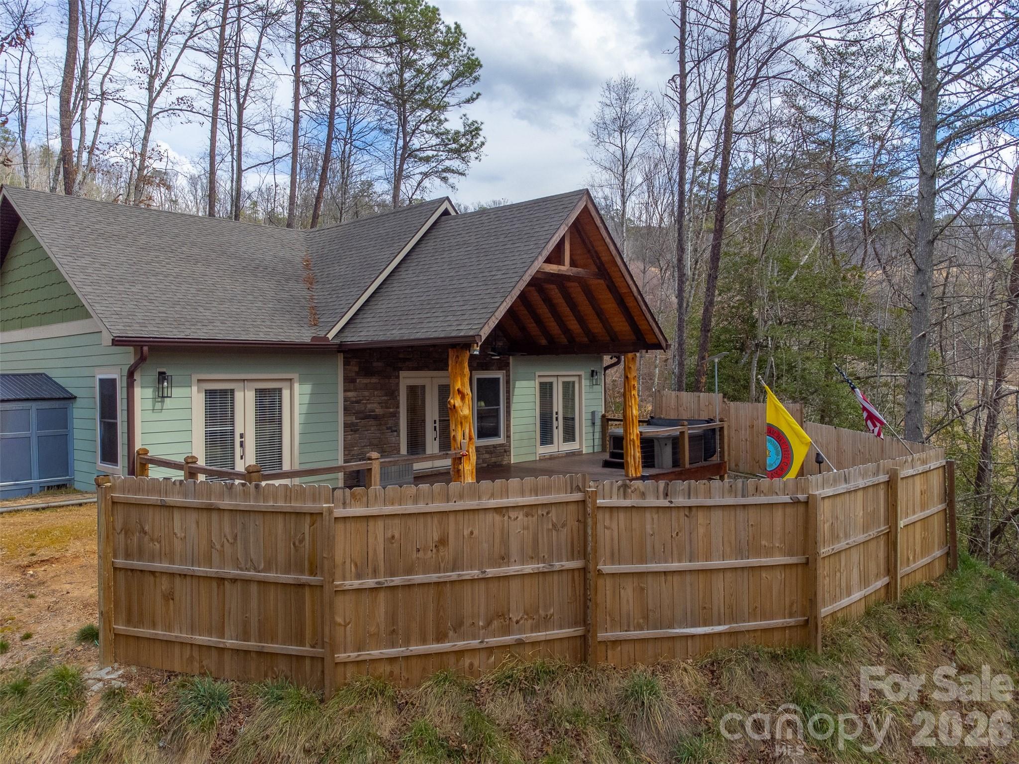79 Abbey View Road Bryson City, NC 28713 - Photo 47 of 48 a view of a house with roof and wooden fence