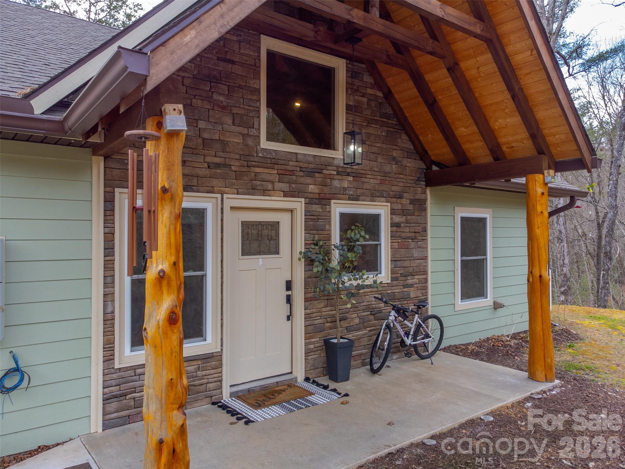 79 Abbey View Road Bryson City, NC 28713 - Photo 5 of 48 a view of a house with tub and porch