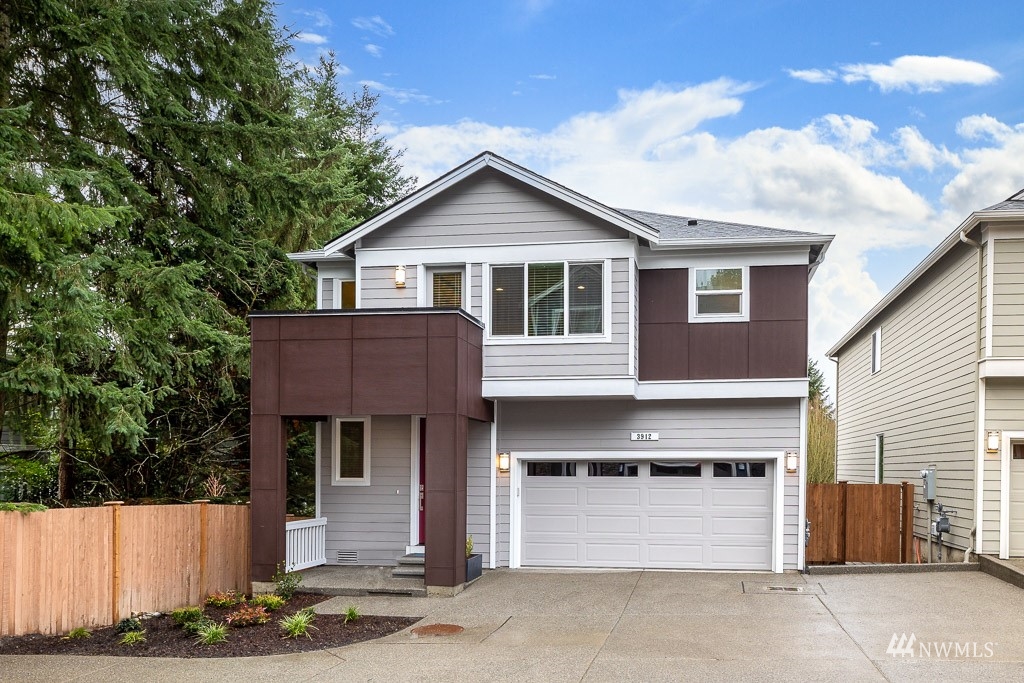 614 215th Street Southeast, Unit RM5 Bothell, WA 98021 - Photo 1 of 29 a front view of a house with a yard
