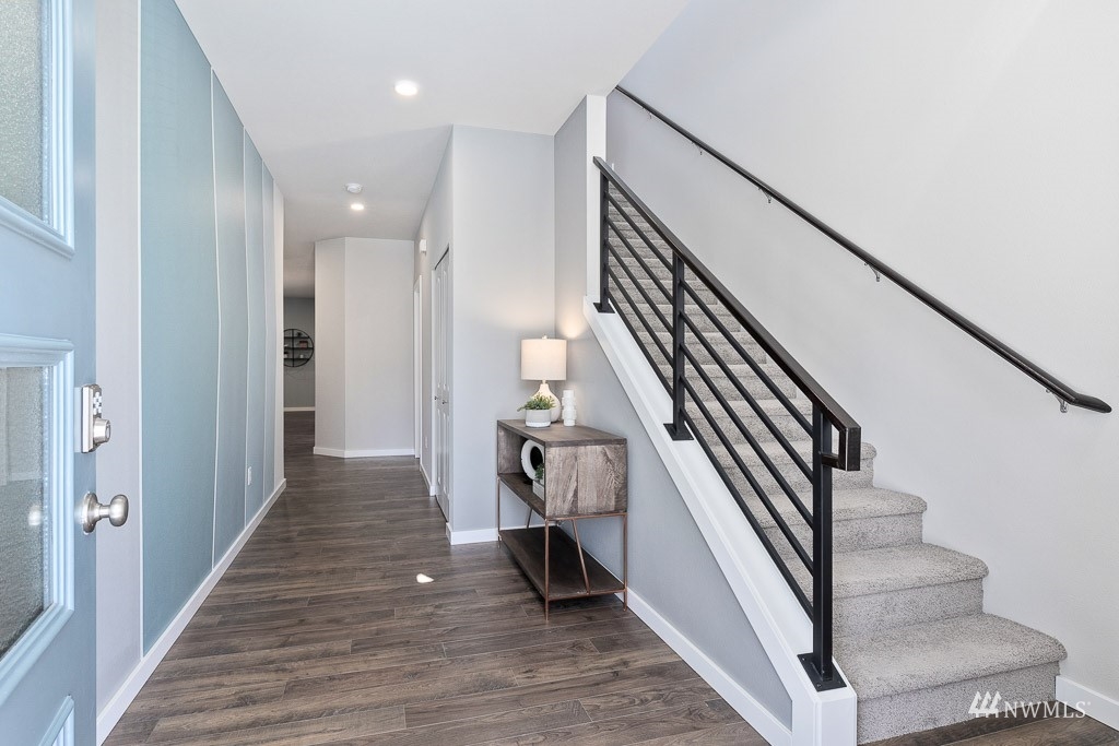 614 215th Street Southeast, Unit RM5 Bothell, WA 98021 - Photo 2 of 29 a view of a hallway with wooden floor and entryway