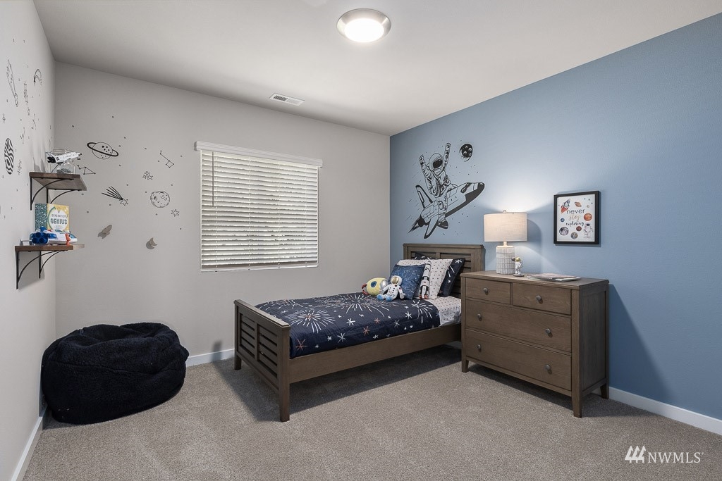614 215th Street Southeast, Unit RM5 Bothell, WA 98021 - Photo 26 of 29 a bedroom with a bed and a window
