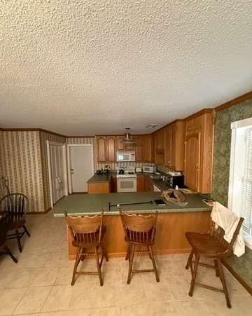 93 Rue Beauregard Lavonia, GA 30553 - Photo 11 of 26 a view of a dining room with furniture window and outside view