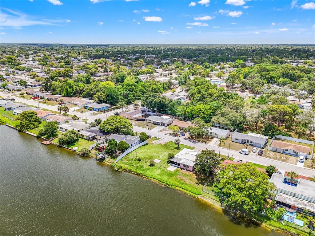 7211 Ashwood Drive Port Richey, FL 34668 - Photo 3 of 12 a view of a lake with outdoor space