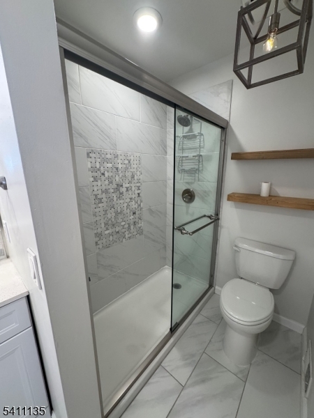 50 West Lindsley Road, Unit 42 Cedar Grove, NJ 07009 - Photo 12 of 26 a bathroom with a toilet and a shower