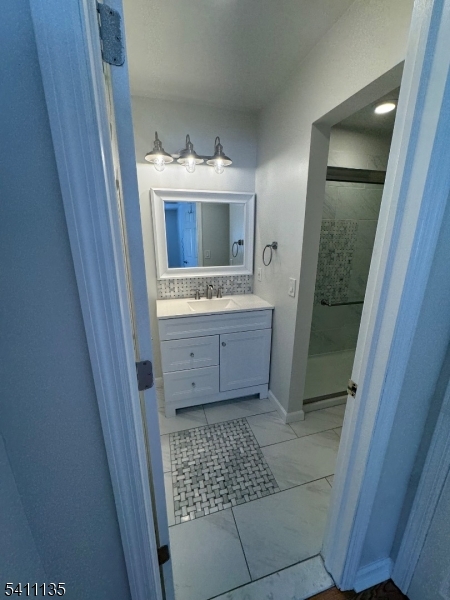 50 West Lindsley Road, Unit 42 Cedar Grove, NJ 07009 - Photo 13 of 26 a bathroom with a sink toilet and shower