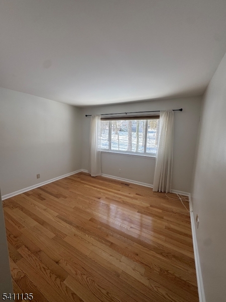 50 West Lindsley Road, Unit 42 Cedar Grove, NJ 07009 - Photo 14 of 26 a view of empty room with wooden floor and fan