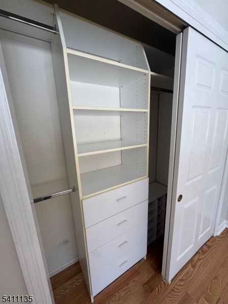 50 West Lindsley Road, Unit 42 Cedar Grove, NJ 07009 - Photo 16 of 26 a view of walk in closet with empty racks