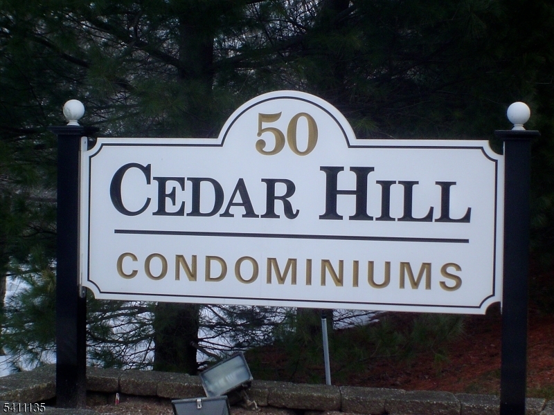 50 West Lindsley Road, Unit 42 Cedar Grove, NJ 07009 - Photo 26 of 26 a street sign that is on a wooden wall