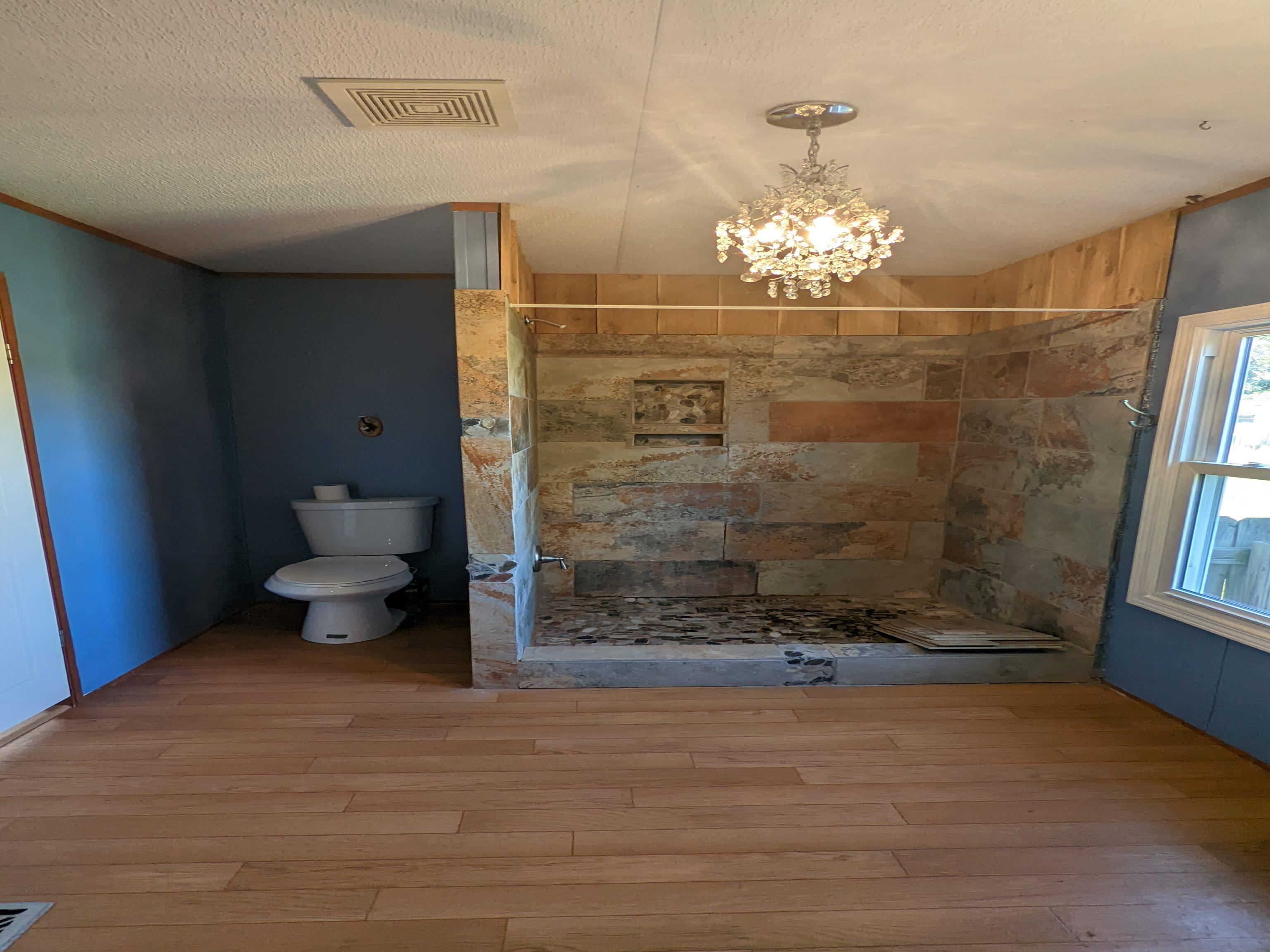 793 Robertson Road Mason, TN 38049 - Photo 11 of 23 a bathroom with a toilet shower and a sink