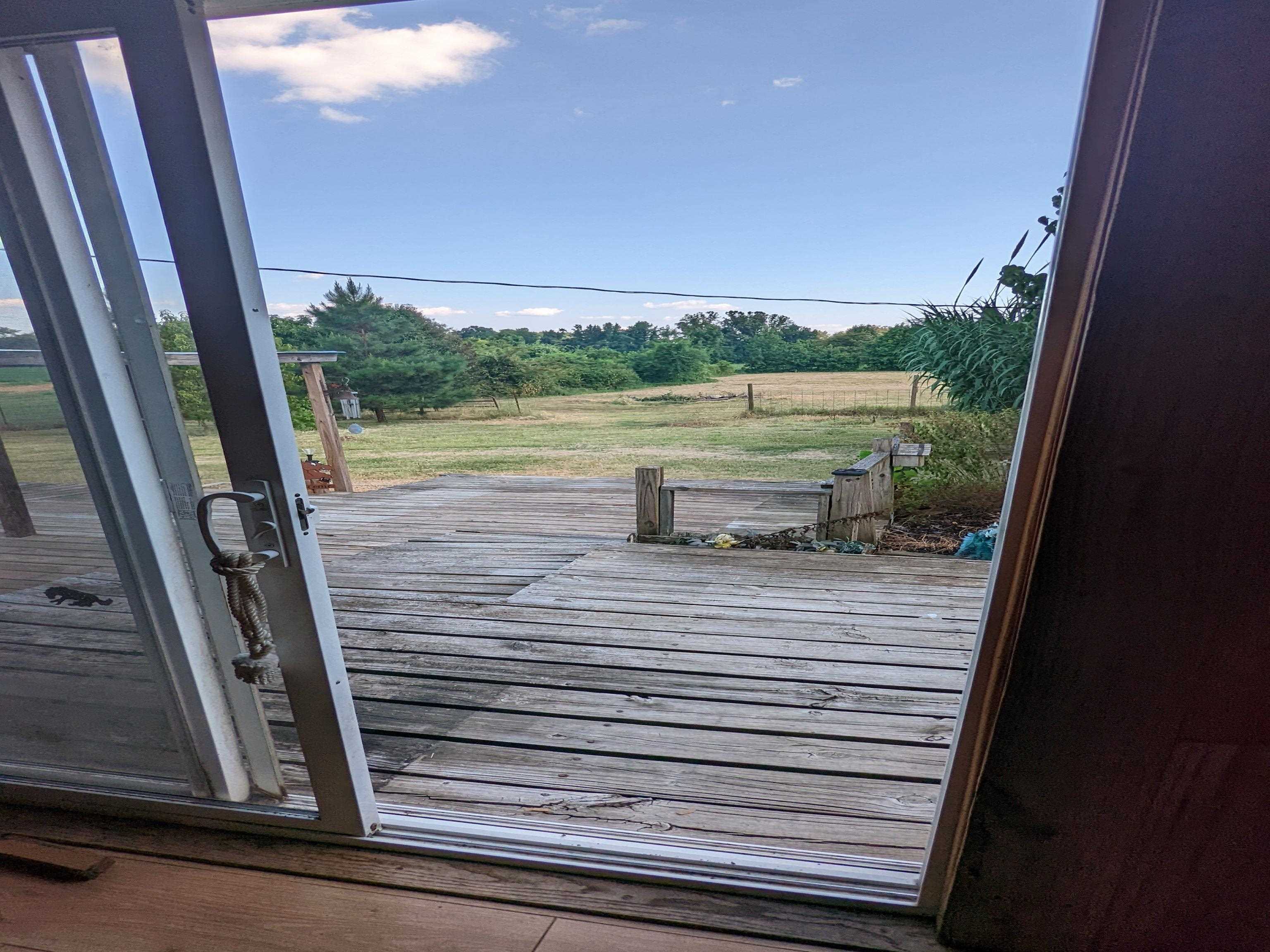 793 Robertson Road Mason, TN 38049 - Photo 17 of 23 a view of a lake from a window