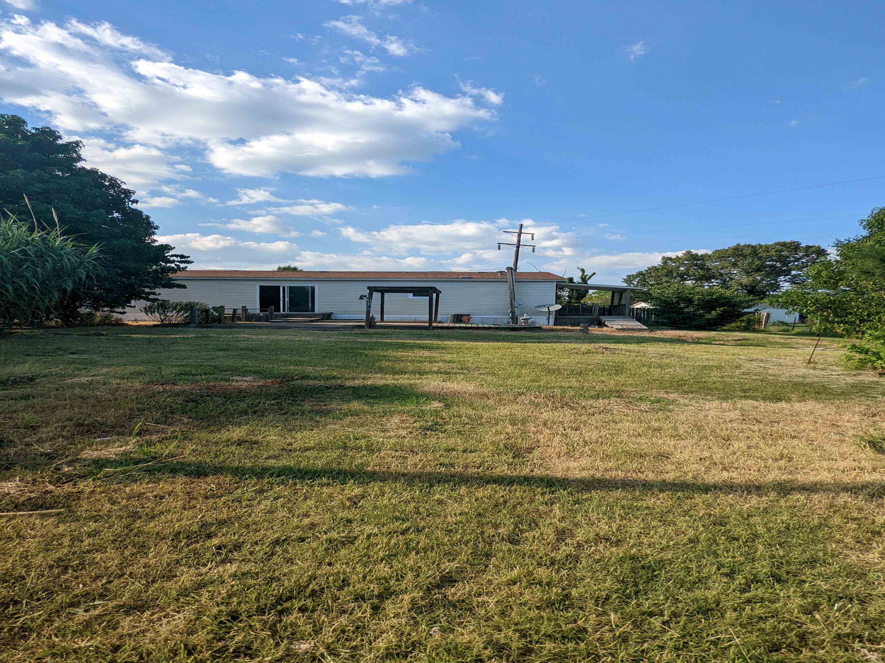 793 Robertson Road Mason, TN 38049 - Photo 19 of 23 a view of a large body of water with a building in the background